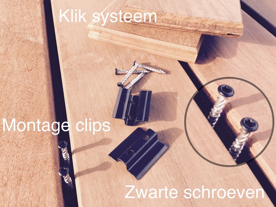 Close-up of decking boards with invisible fixing system using clips and screws.