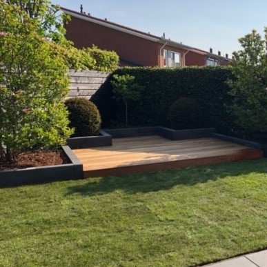 Luxury design garden featuring a sleek Ipe hardwood deck and modern plants