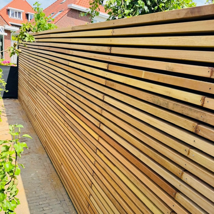 Premium horizontal fencing featuring thick Ipe timber slats for a contemporary slatted look.