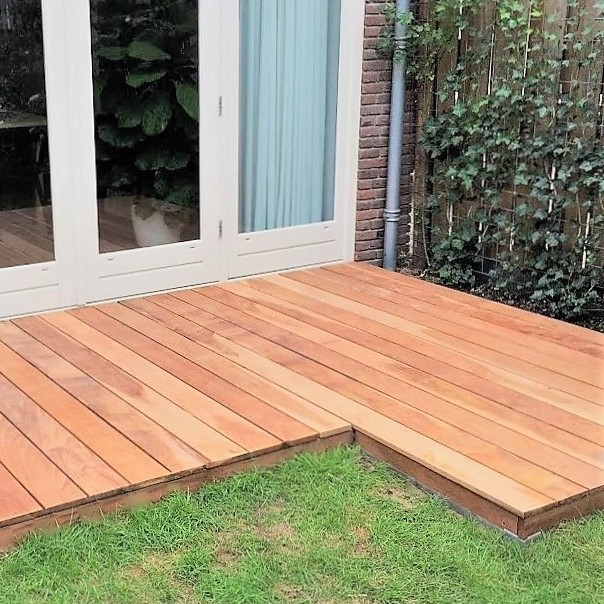 Luxury hardwood deck seamlessly connecting to French garden doors