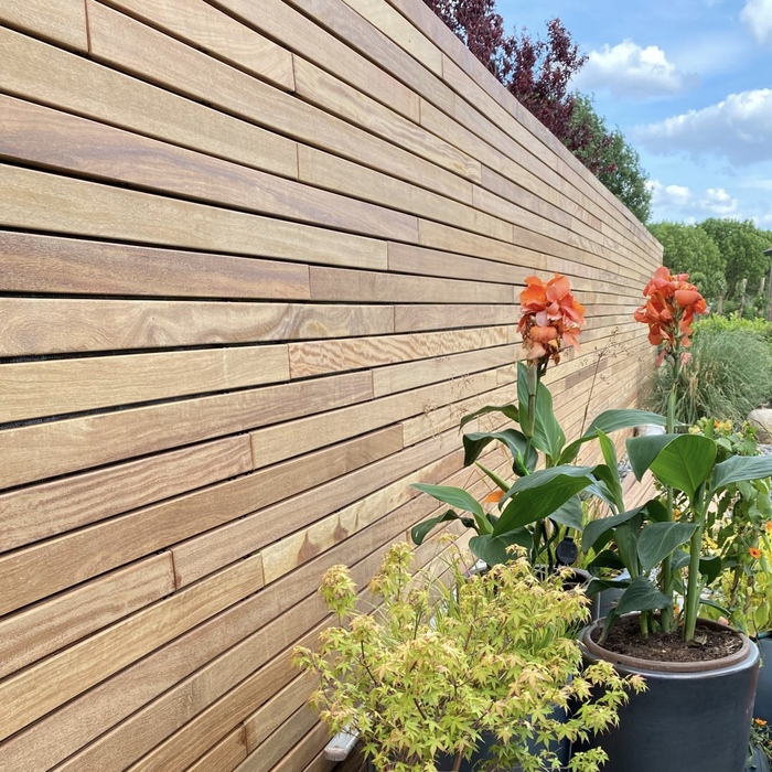 Premium horizontal Ipe hardwood slatted fence providing a contemporary look and garden privacy